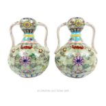 A Pair of Twin Famille Vert Vases.