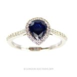 An 18 Carat White Gold Pear Shaped Sapphire and Diamond Ring.
