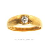 An 18 carat yellow gold single diamond set ring.