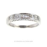 An 18 Carat White Gold Diamond Set Half Eternity Ring.