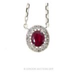 An 18 Carat White Gold Ruby and Diamond Pendant Necklace.