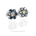 A Pair of Platinum Mounted Blue Diamond Cluster Earrings.