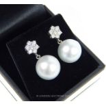 A Fine Pair of 18 Carat White Gold Diamond And Cultured Pearl Drop Earrings.