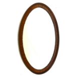 An Oval Wall Mirror.