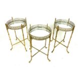 Three folding gilt metal and mirrored top wine tables.