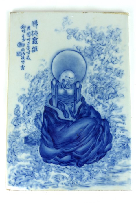 Chinese blue and white tile with a figure and text.