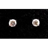 A Pair of 14 Carat White Gold Diamond Stud Earrings.