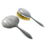 A Hand Mirror and Hair Brush.