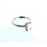 White gold Emerald cut Diamond ring.