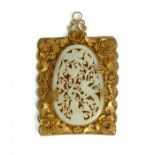 A Framed jade decorative plaque in a gilt filigree frame.