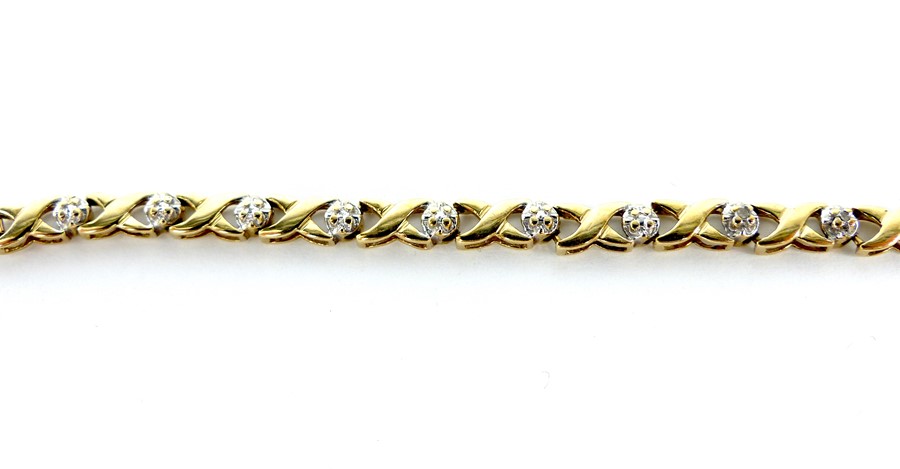 A 9 Carat Diamond and Kiss Bracelet. - Image 2 of 2