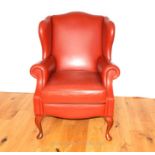 A Contemporary Red Leather Wing Back Arm Chair.