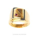 An 18 Carat Yellow and White Gold Ruby Set Ring.