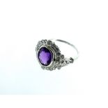 A Silver Cubic Zirconia Amethyst Ring.