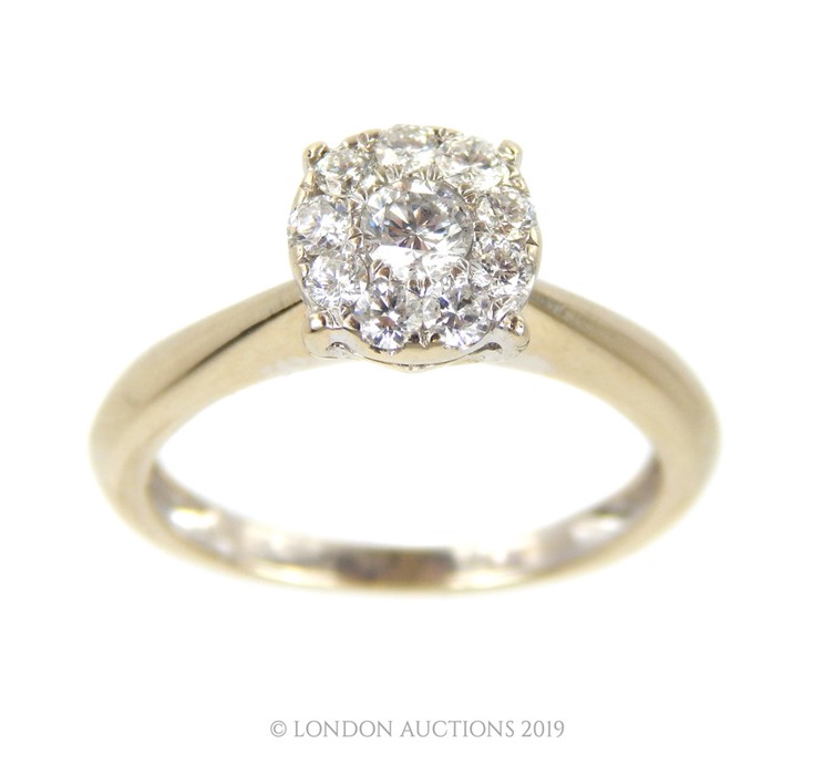 A 14 Carat White Gold Diamond Ring.