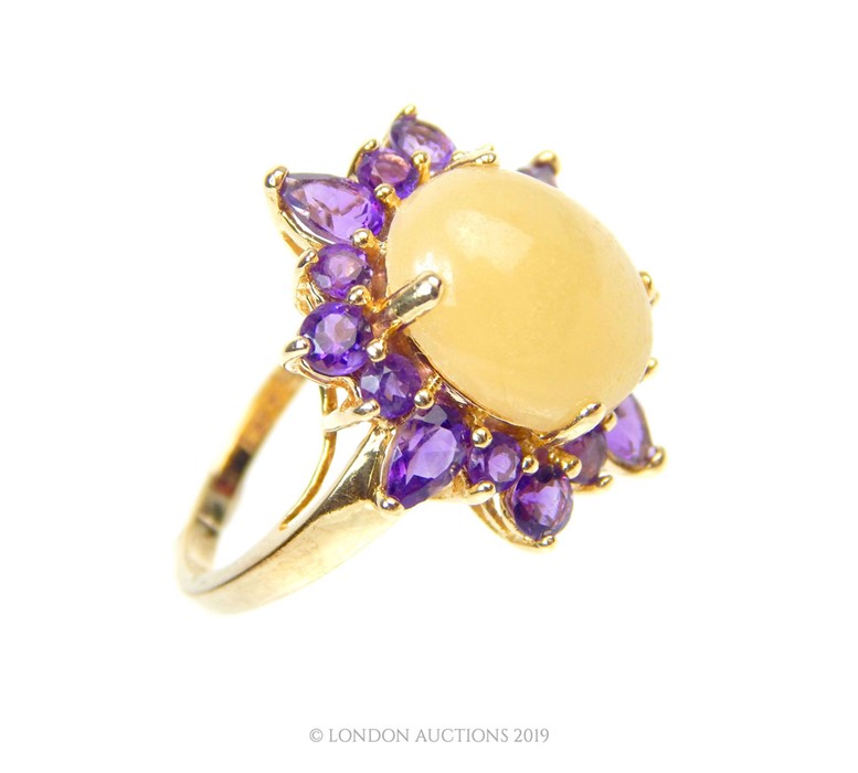 A 14 Carat Gold Oval Claw Cabochon White Jade with Halo of Amethyst Ring. - Image 3 of 4