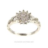 A 9 Carat White Gold Diamond Cluster Ring.