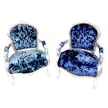 Two Upholstered children's chairs.