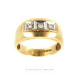 A Mens 10 Carat Yellow and White Gold Ring.