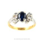 An 18 Carat Gold Oval Cut Kashmir Sapphire and Diamond Ring.