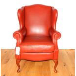 A Contemporary Red Leather Wing Back Arm Chair.
