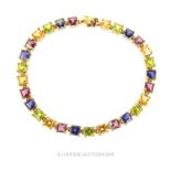 A 10 Carat Gold Garnet, Peridot, Citrine and Tolite Bracelet.