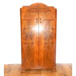 A 20th Century Maple Wood Wardrobe.