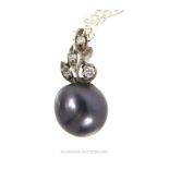 A South Sea Pearl And Diamond Pendant Necklace.