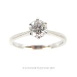 An 18 Carat White Gold Single Stone Diamond Ring.