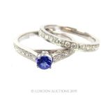 An 18 Carat White Gold Tanzanite And Daimond Ring With Mathing Diamond Half Eternity Ring. Size: M 6