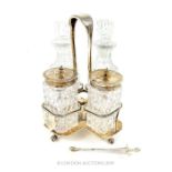 A Four Bottle Sterling Silver Cruet Set