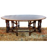 A Late Victorian Drop Leaf Oval Table.