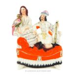 A Victorian (1850's) Staffordshire Flatback, Scottish Couple Holding A Lute And Parrot.