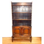 A Small Late Victorian Oak Bookcase With Cabinet H:137 cm W:65 cm D:27 cm.