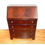 A Mahogany Bureau With Four Draws And Leather Writing Top H:100 cm W:75 cm D 43 cm.