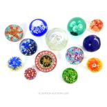 A Quantity Of Floral Style Paperweights.