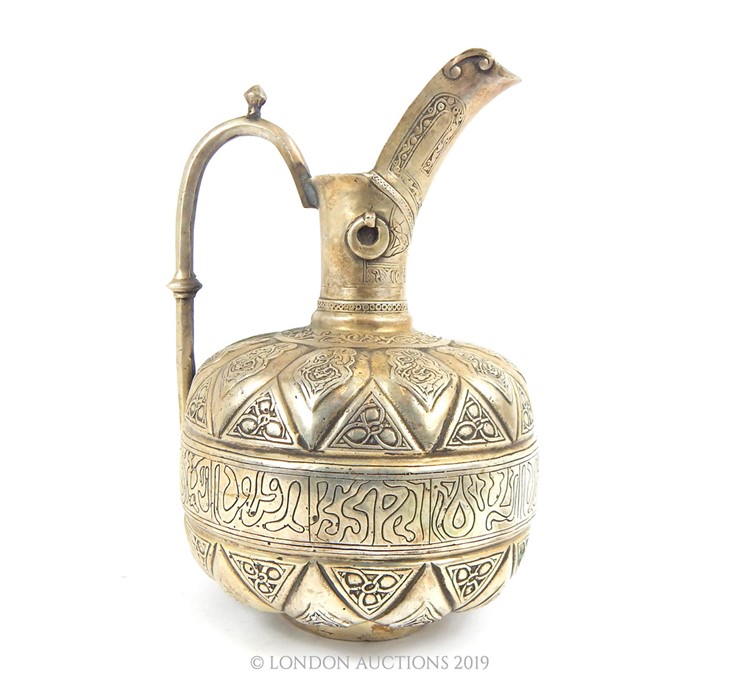 A Large Islamic White Metal Ewer.