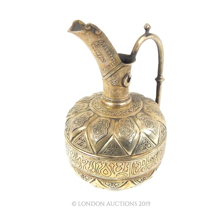 A Large Islamic White Metal Ewer. - Image 2 of 3