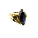 A Vintage 9 carat Gold Marques Cut Black Sapphire Flanked by Diamond Ring.