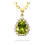 An 18 Carat Yellow Gold Peridot And Diamond Pendant Necklace.