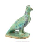 A Ceramic Sculpture Of A Bird