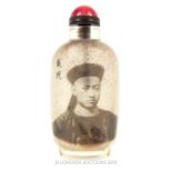 A Snuff Bottle Depicting A Portrait Of A Man.