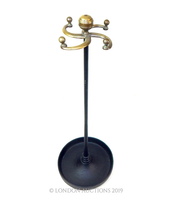 A Cast Iron And Brass Cane Stand.