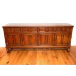 An Early 20th Century Oak Sideboard on legs with two D Cups. A bit of damage to the top. H: 82 cm