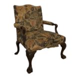 A George III Carved Walnut Gainsborough Armchair.