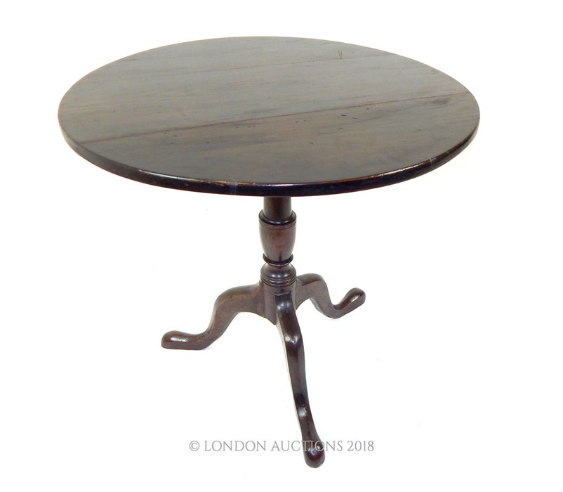 A late 18th Century Oak Tilt Top Table.