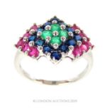 A Vintage Nine Carat White Gold Emerald, Sapphire And Ruby Ring.