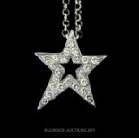 An 18 Carat White Gold Star Pendant And Chain.