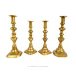 Four Brass Candle Holders.