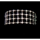 An 18 Carat White Gold And Mesh Bracelet.